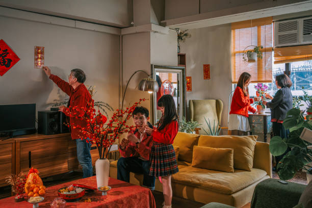 istock Chinese multi generation family decorating house preparing for Chinese New Year Celebration 2194703276