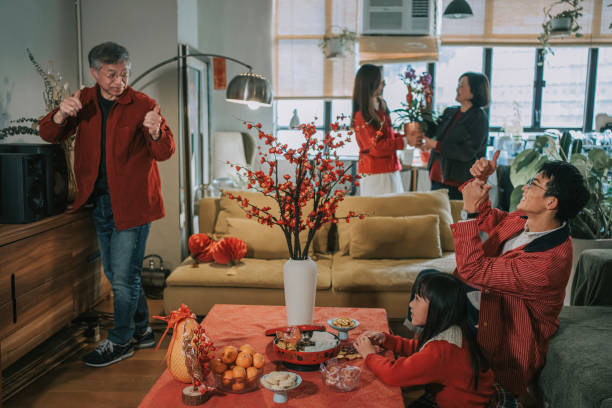 istock Chinese multi generation family decorating home preparing for Chinese New Year Celebration 2194703287