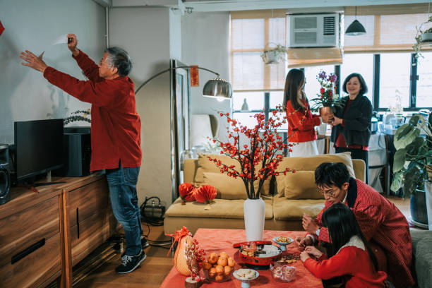 istock Chinese multi generation family decorating house preparing for Chinese New Year Celebration 2194703292