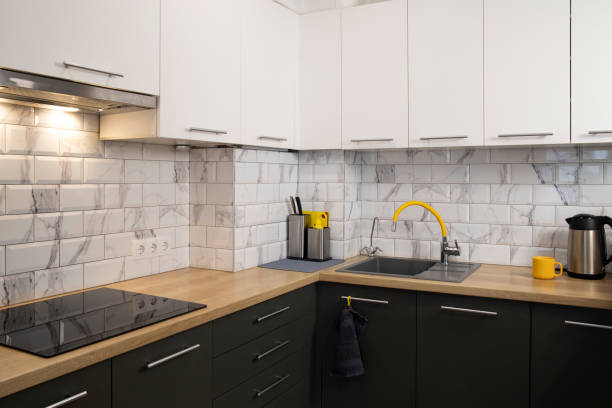 istock Modern and stylish white and grey kitchen with yellow accents 2194703756