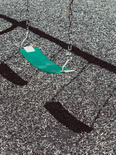 istock Children's Swings Set on Playground 2194704131