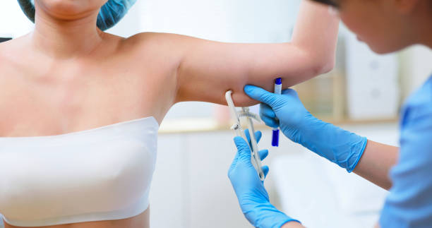 istock asian woman arm fat examined 2194704539