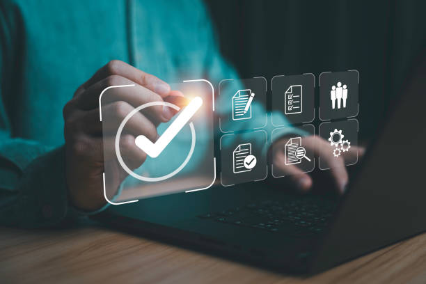 istock Businessman using laptop computer with correct sign mark and document icon and human for ISO or International Standard Organization which related quality control and continuous improvement concept. 2194704551