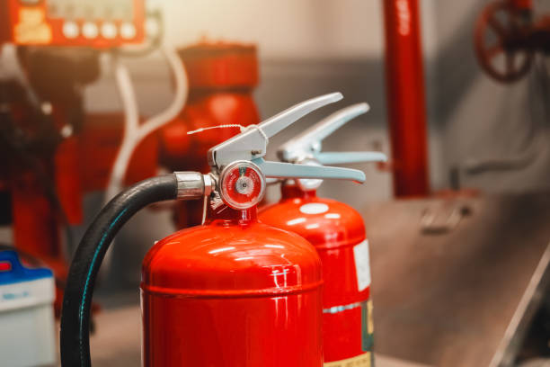 istock Engineer checks fire extinguisher in fire control room to ensure safety. When an emergency occurs 2194705003
