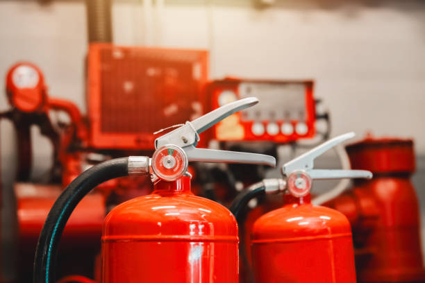 istock Engineer checks fire extinguisher in fire control room to ensure safety. When an emergency occurs 2194705005