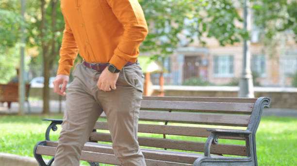 Young Man Leaving Bench in front of Office