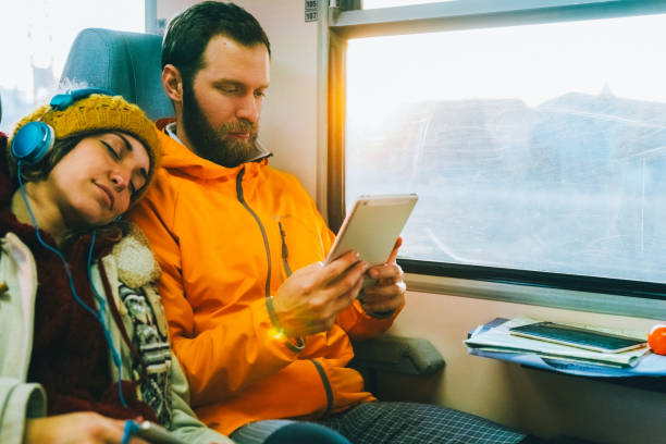 istock Couple traveling with train 2194707195