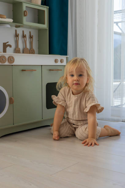 istock Toddler plays in a cozy indoor kitchen setting on a sunlit afternoon expanding creativity and imagination 2194715620