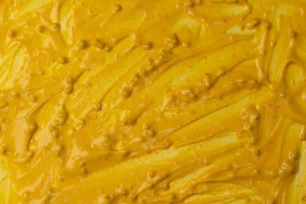 istock Yellow sauce splashes as a background. 2194716399