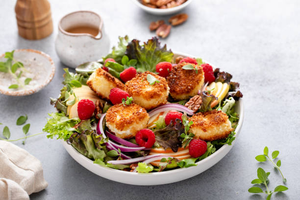 istock Fresh goat cheese salad with mixed greens and berries 2194717742