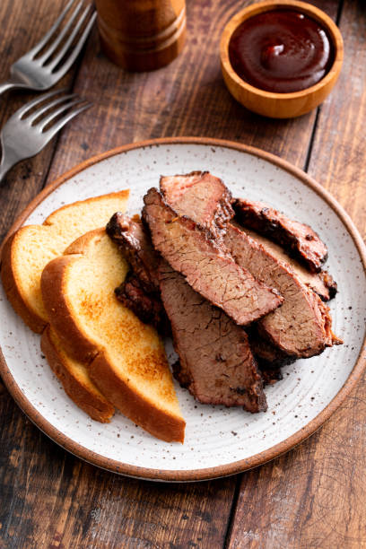 istock Juicy smoked brisket slices with toast on plate 2194717793