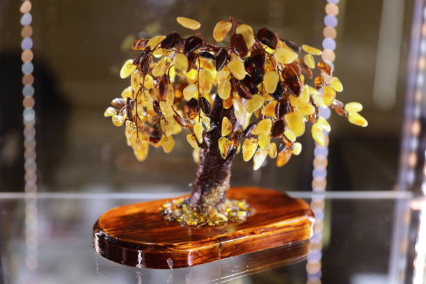 A unique stone structure resembling a small tree, composed of yellow and brown stones.