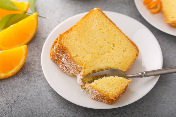 istock Orange pound cake slice on a plate, bundt cake topped with powdered sugar 2194719647