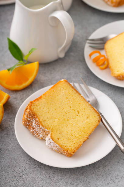 istock Orange pound cake slice on a plate, bundt cake topped with powdered sugar 2194719657