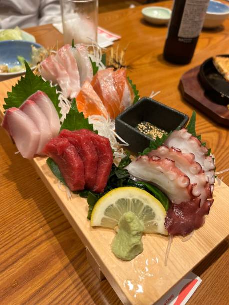 Sashimi, a Japanese delicacy featuring thinly sliced raw fish, served fresh and beautifully arranged for a pure and flavorful experience.