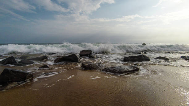 istock Beach with red sand and red rocks with a dramatic sky in Congo Town, Monrovia, Liberia 2194722114