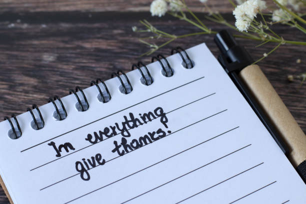 istock In everything give thanks, handwritten text in notebook on wooden desk 2194722909