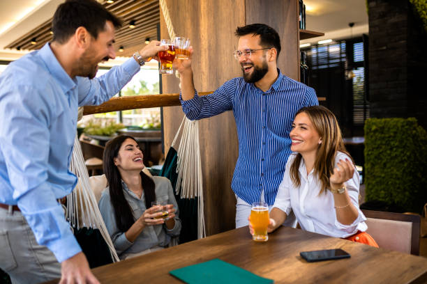 istock Group of friends toasting in a restaurant with alcohol 2194724700