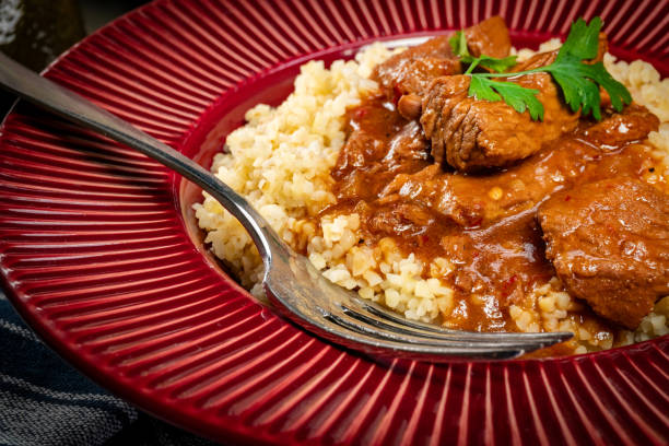 istock Chunky beef stew with savory sauce, served with bulgur groats. 2194726986