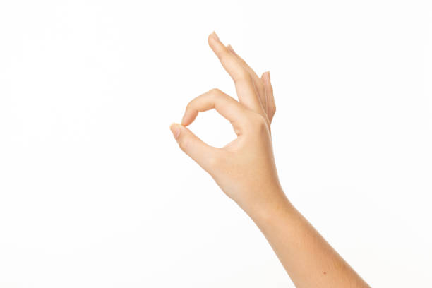 istock Woman hand ok sign on a white isolated background 2194727018