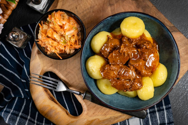 istock Beef stew in gravy, served with potato dumplings. 2194727092