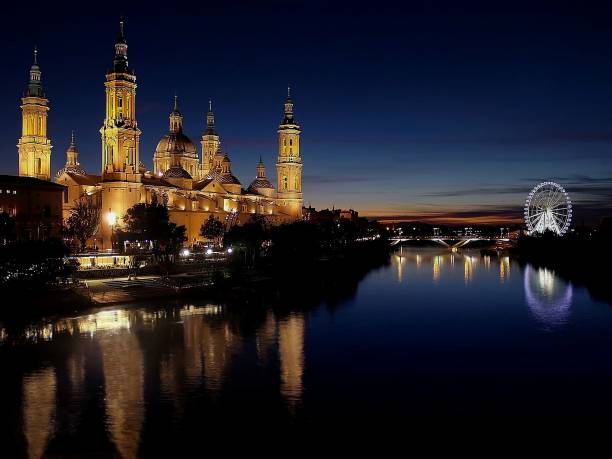 istock The Pilar at night and its reflection in the Ebro River 2194727710