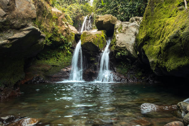 istock Twin Waterfalls Flowing into a Crystal Clear Pool 2194727927