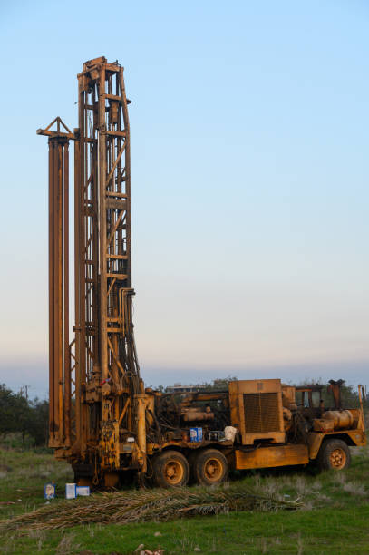 istock Rustic drilling rig standing tall in the serene landscape at dawn 2194728216