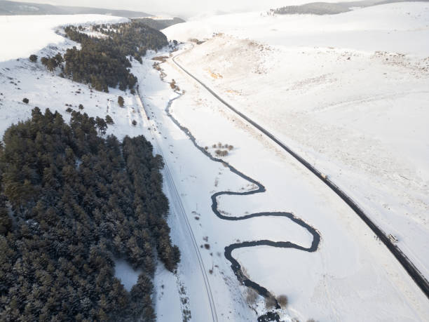 Free Stock Photo of Aerial view of icy river and snow-covered land ...