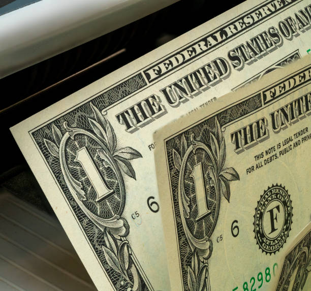 istock Unique one-dollar bill being printed in a currency-operated machine 2194728894