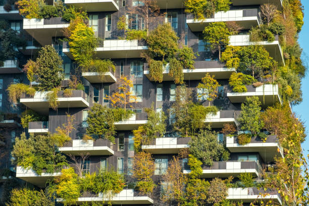 Vertical forest building with lush greenery and trees integrated into modern architecture, Milan, Italy. Vertical garden and landscaping, innovative architecture, urban sustainability