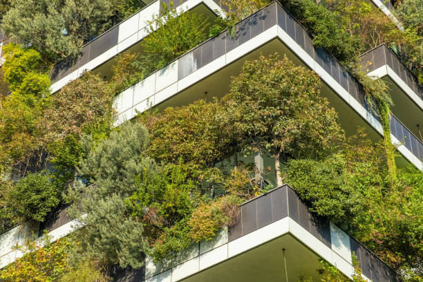 istock Close up of vertical forest building with lush greenery and trees integrated into modern architecture, Milan, Italy. Vertical garden and landscaping, innovative architecture, urban sustainability 2194729609