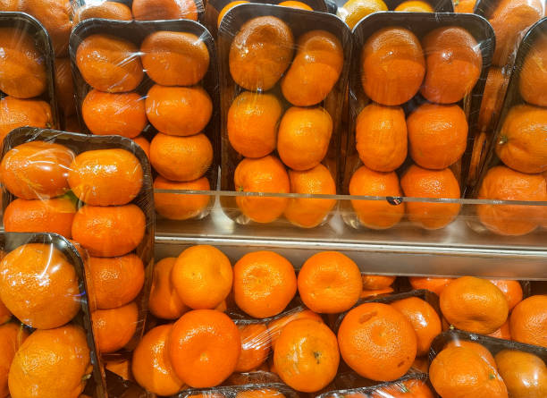 istock Tangerine in plastic bags 2194729631