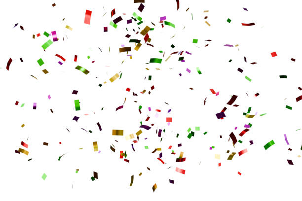 Multicolored paper ribbons, free falling confetti on a black background. Party atmosphere concept.