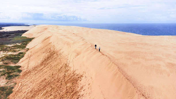 istock View Of People Walking On Dune 2194729680
