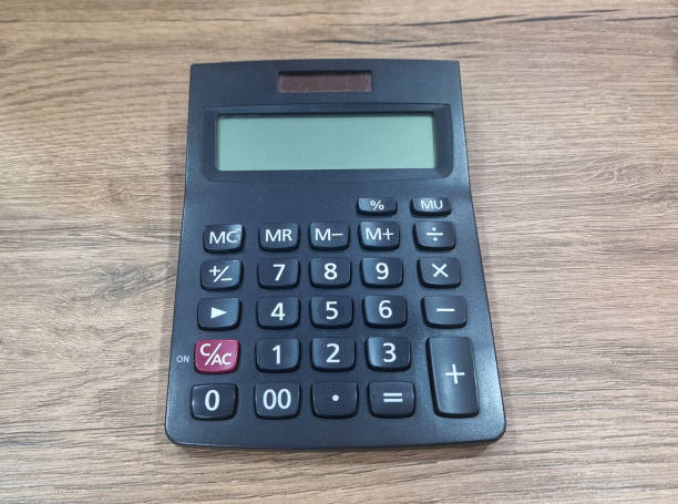 istock Calculator on wooden background 2194729686