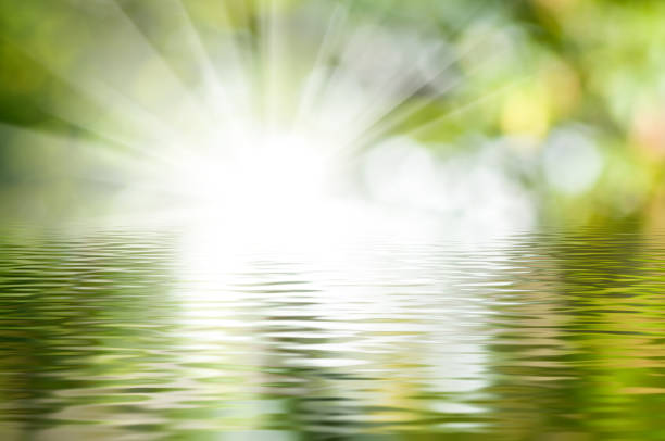 istock Reflections of light on tranquil waters create a serene and enchanting atmosphere in nature's embrace at dawn 2194730732