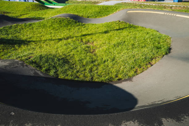 istock In a bustling park, a skilled skateboarder makes his way down a smooth concrete ramp, showcasing his talent and agility on wheels as he navigates the urban environment with precision 2194736148