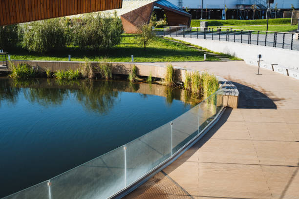 istock A stunningly designed bridge elegantly spans across a serene body of water, featuring an exquisite glass railing that significantly enhances its modern aesthetic appeal and unique charm 2194736164