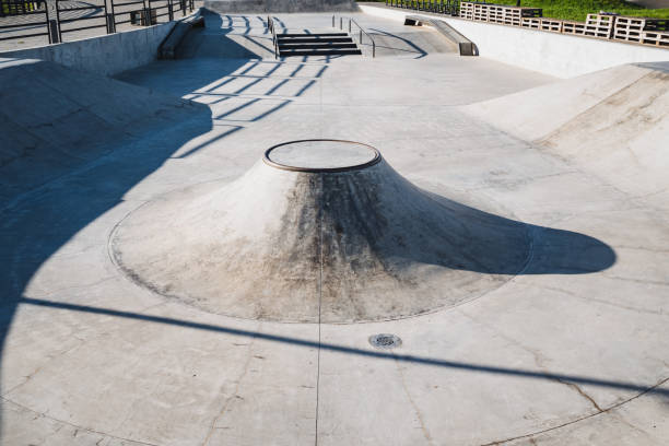 istock The Sunny Skatepark Bowl features beautifully Smooth Concrete and captivating Shadows, perfect for skaters and their thrilling rides 2194736171
