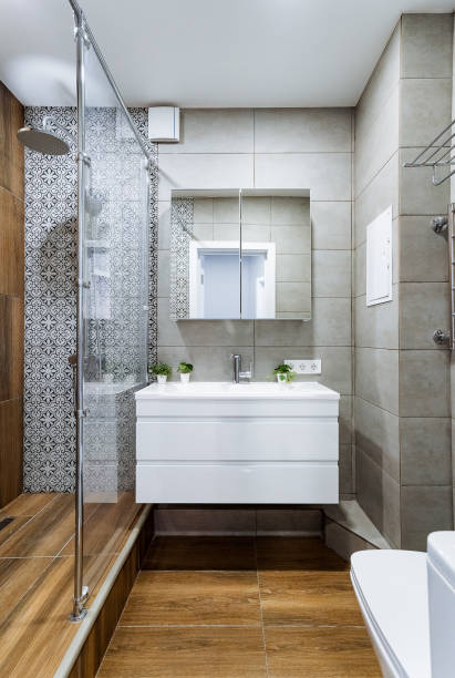 istock Explore the stunning and contemporary modern bathroom design featuring a sleek shower stall and an elegantly stylish vanity for ultimate functionality and aesthetic appeal 2194738002