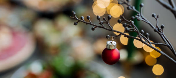 istock A red christmas ball is hanging from a tree branch 2194738961