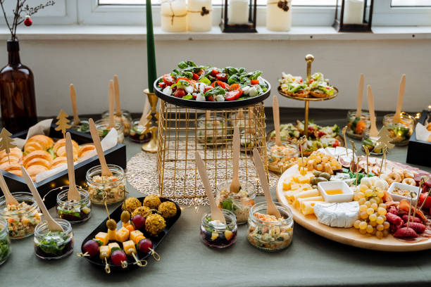 istock The beautifully arranged dining table features a vibrant array of diverse foods, providing unique flavors for an unforgettable culinary experience that delights all guests 2194738967