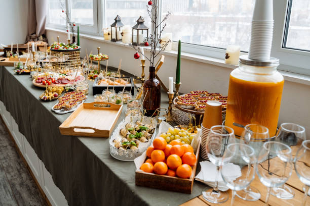 istock A beautifully arranged buffet table that showcases a diverse assortment of delectable food items along with an impressive selection of beverages elegantly displayed on it for all to enjoy 2194738973
