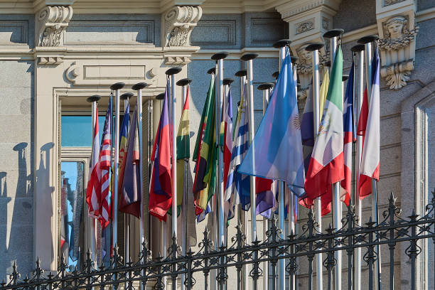 istock International flags flying over historic building 2194739313
