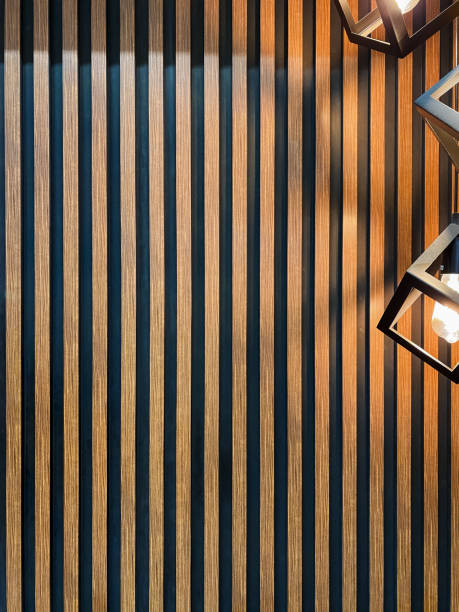 istock This image features a detailed closeup view of a textured wooden wall, adorned with several beautiful lights gracefully hanging from it, creating a warm ambiance and inviting atmosphere 2194740281