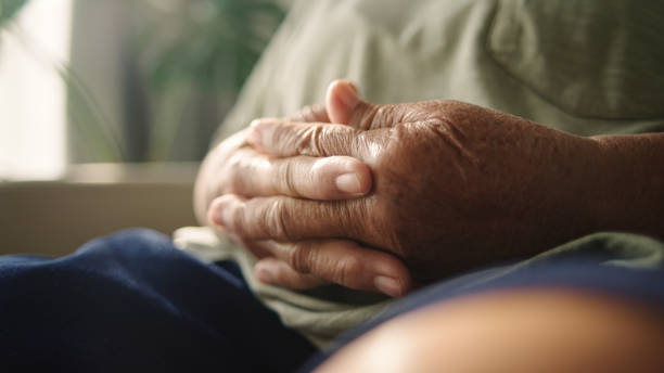istock Hand of elderly meditating. 2194741582