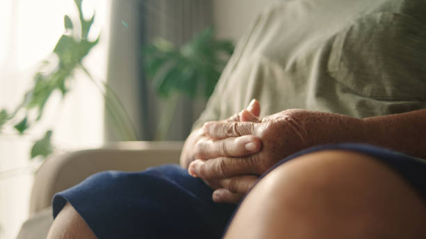 istock Hand of elderly meditating. 2194741594