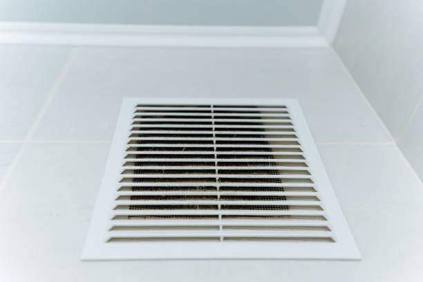 A sleek white air vent is meticulously installed on a pristine wall, enhancing the rooms overall aesthetics and delivering a clean, polished look that captivates everyone who steps into the space