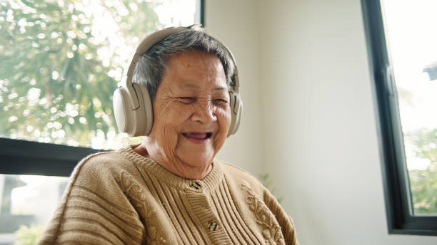 istock Happy elderly watching movie on laptop. 2194742374